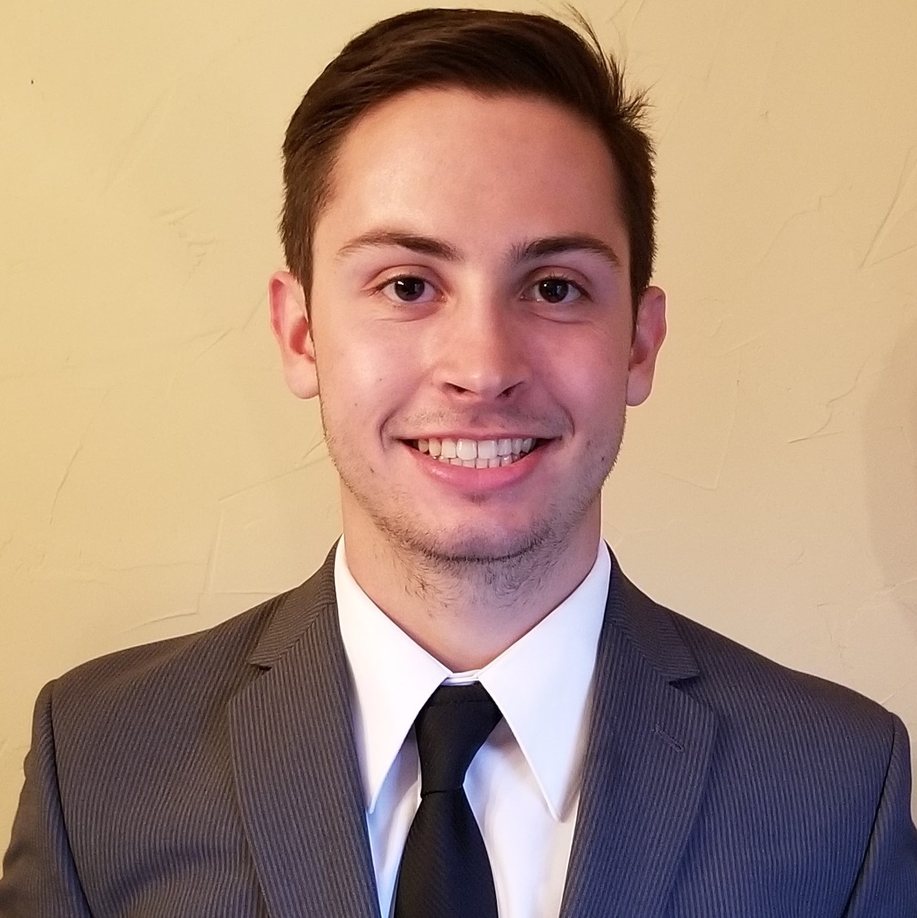 A professional picture of Chase in a suit